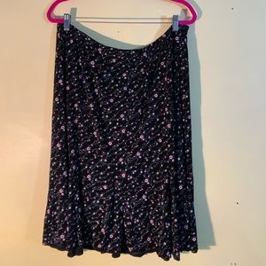 Nylon/spandex blend stretchy skirt. Below knee.